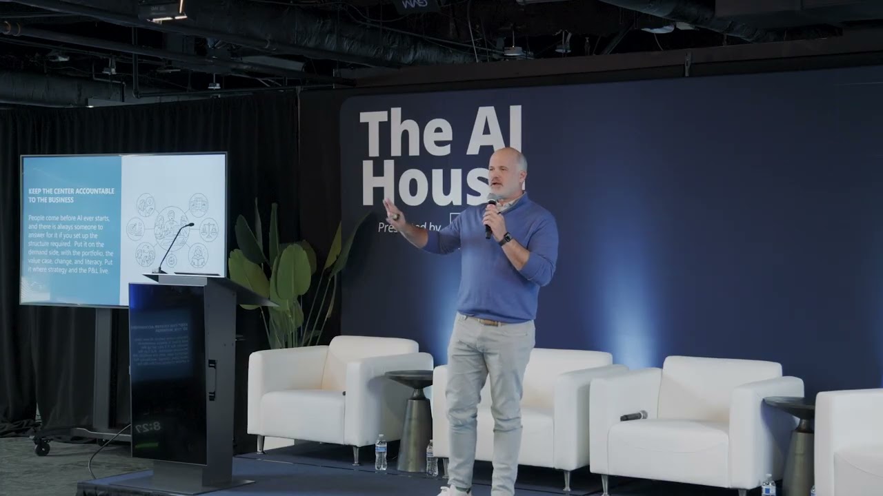 Eric Pace on stage at The AI House, Arlington, delivering the opening keynote.